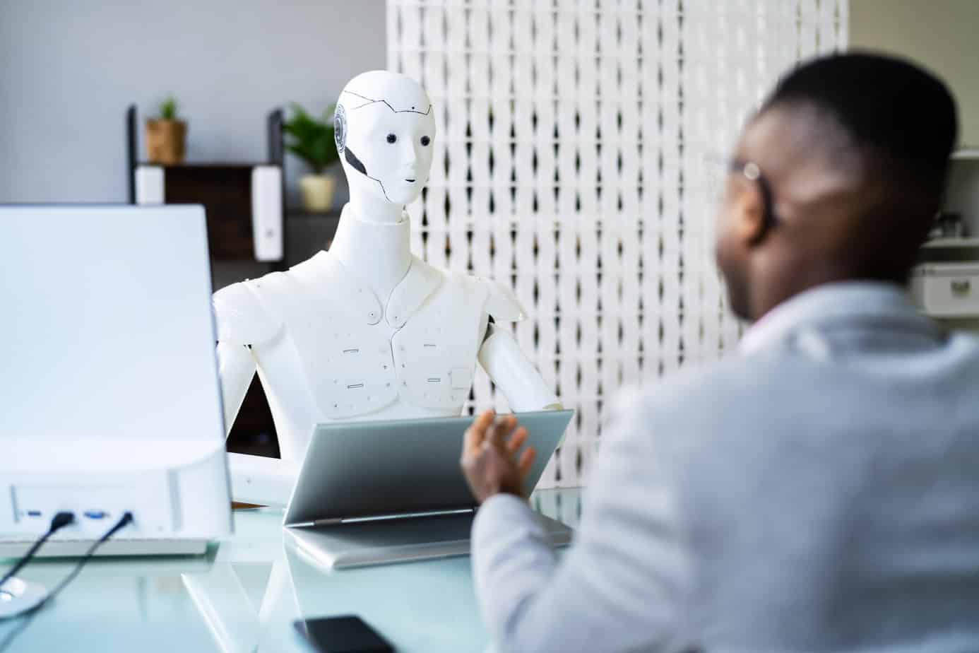 Men At Interview With AI Robot Machine